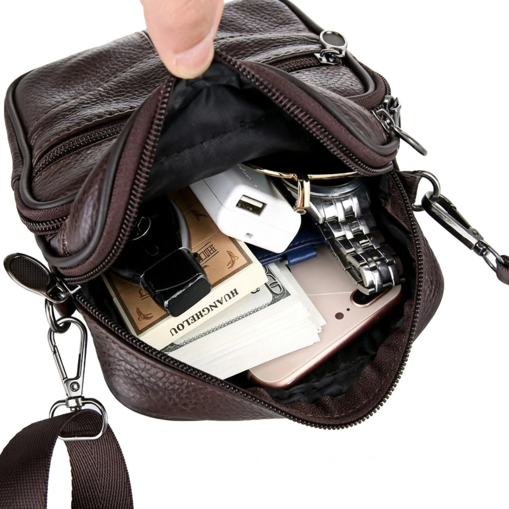 Bolsa de couro masculina transversal com design elegante, acabamento premium e espaço para itens essenciais.
