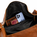 Mala de viagem grande em couro legítimo com amplo espaço interno e design elegante para viagens.